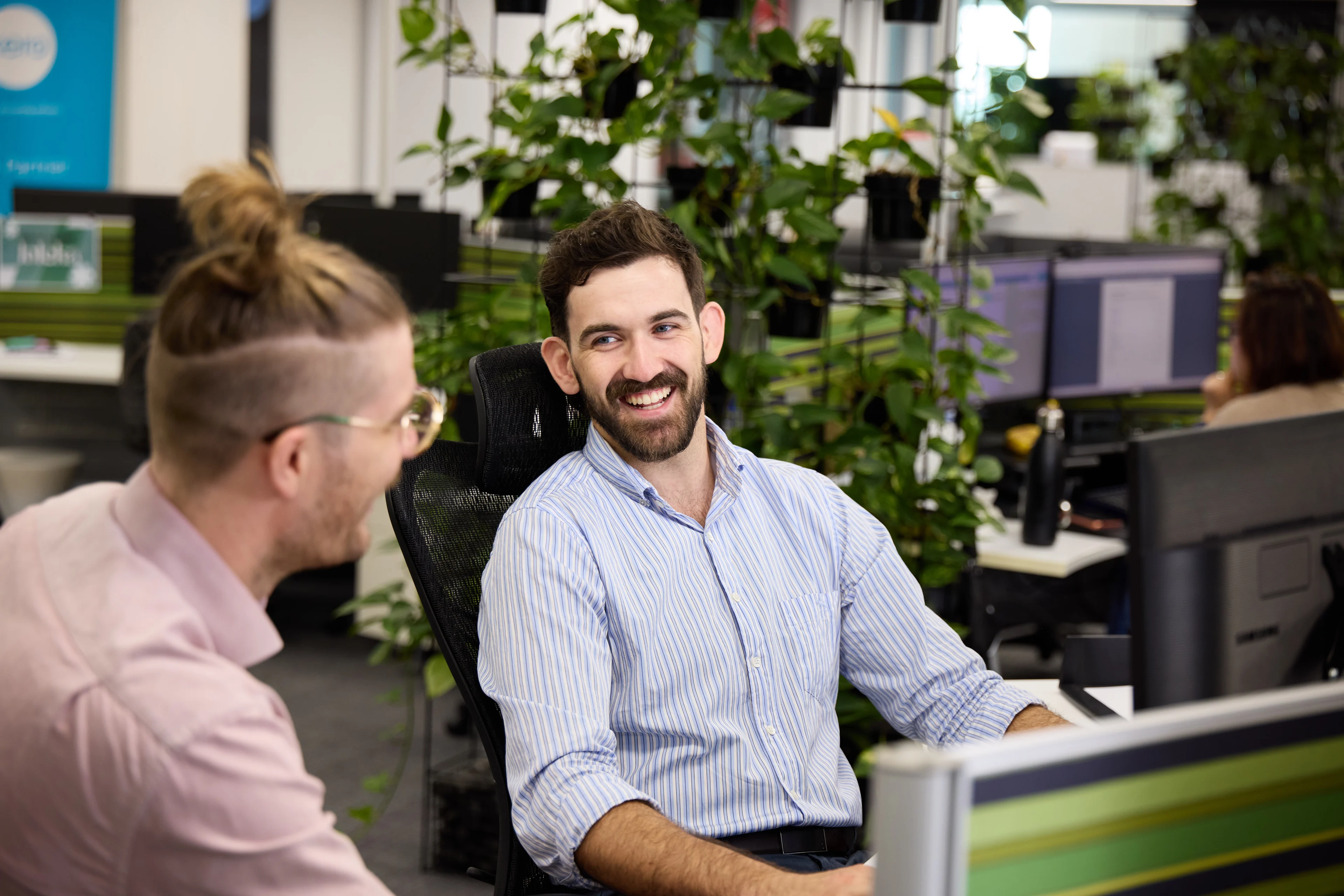 LINK Advance brokers working through a client's file at the Fortitude Valley office