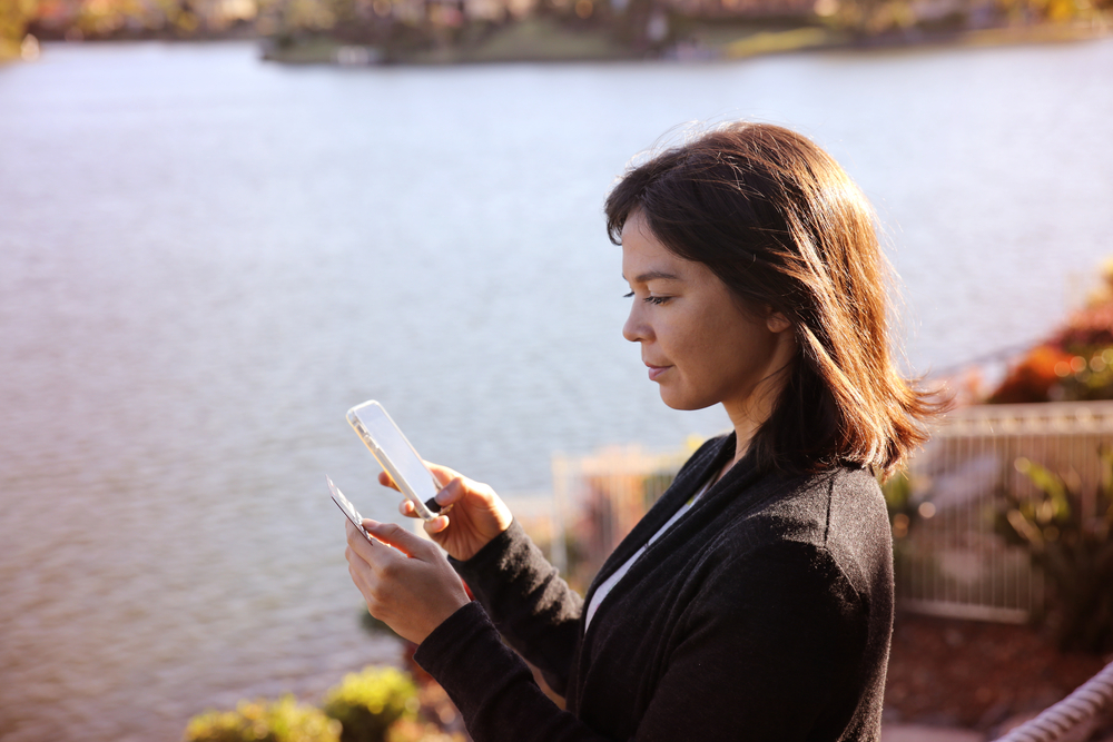 Woman,Holding,Credit,Card,And,Mobile,,,Online,Shopping,,Internet