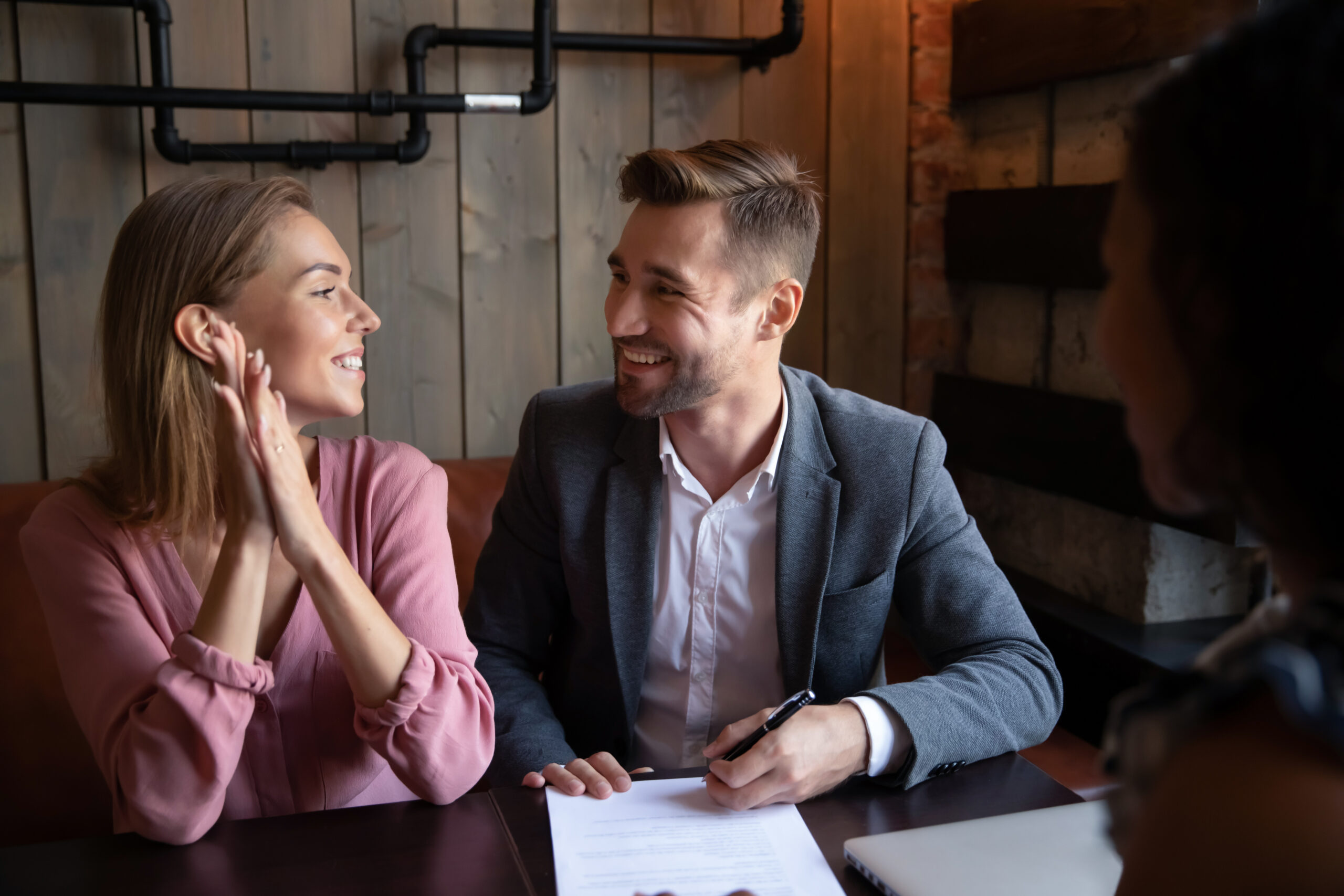 Overjoyed,Young,Couple,Sit,In,Cafe,Meeting,With,Consultant,Or