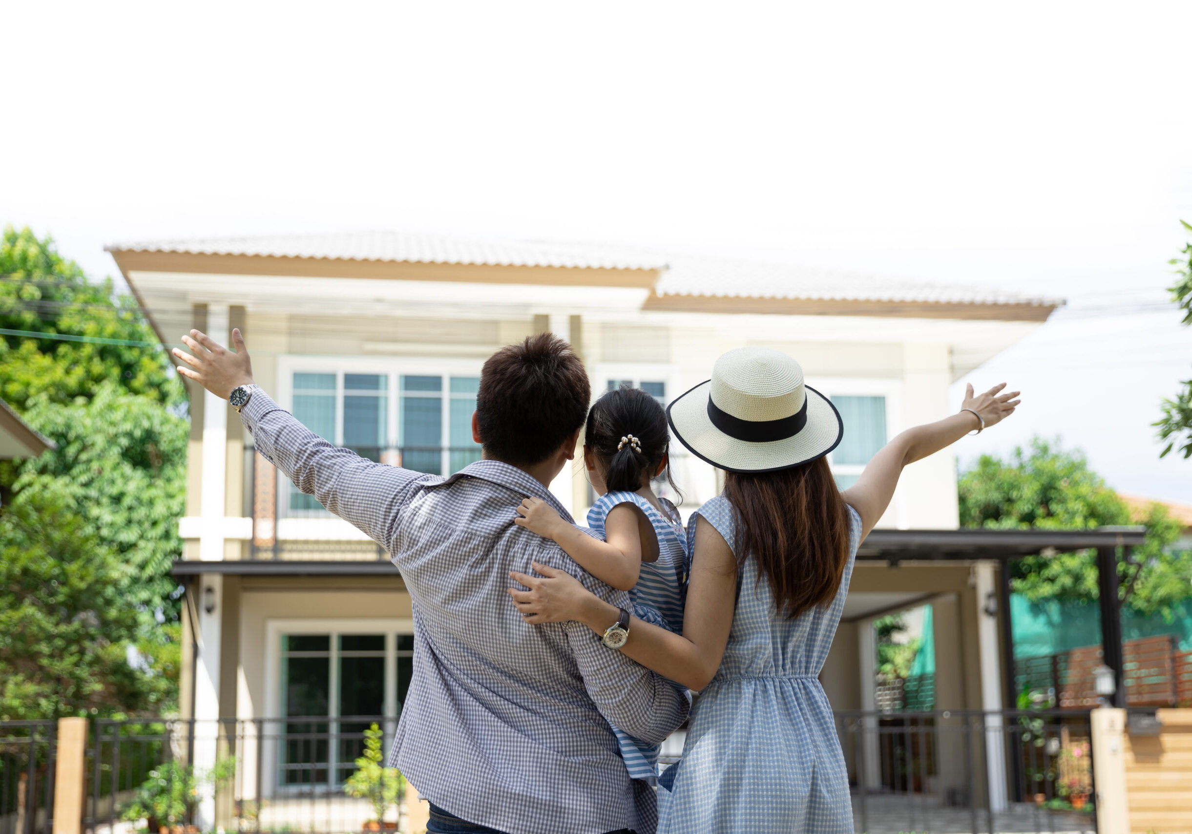 Happy,Asian,Family.,Father,,Mother,And,Daughter,Near,New,Home.