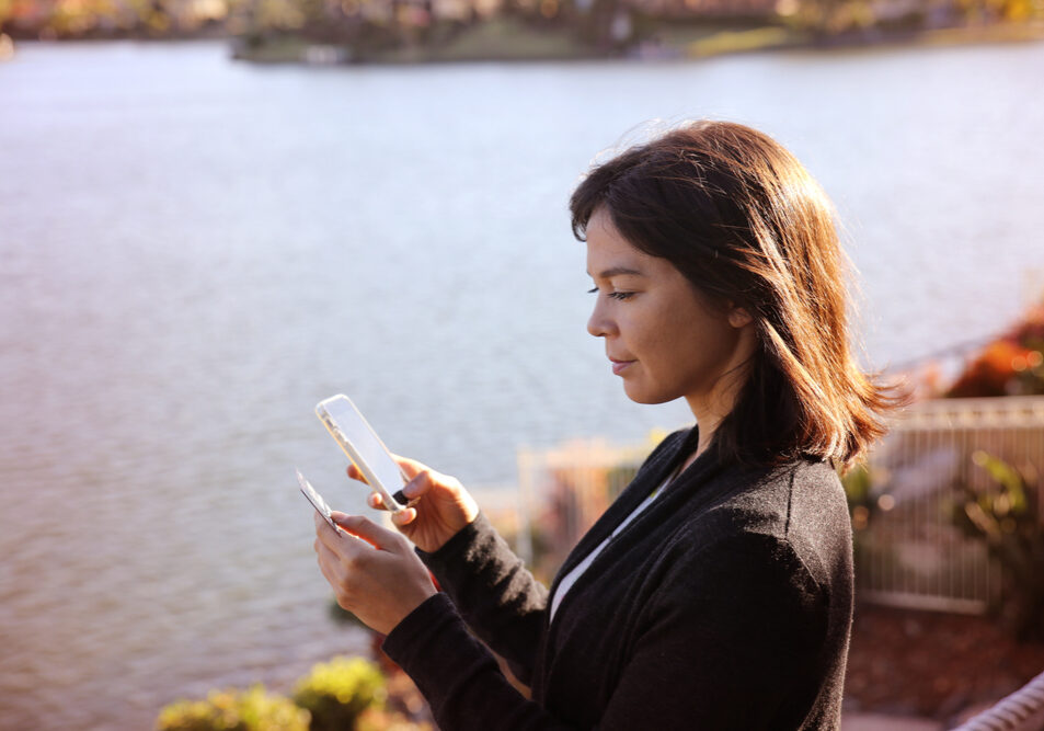 Woman,Holding,Credit,Card,And,Mobile,,,Online,Shopping,,Internet